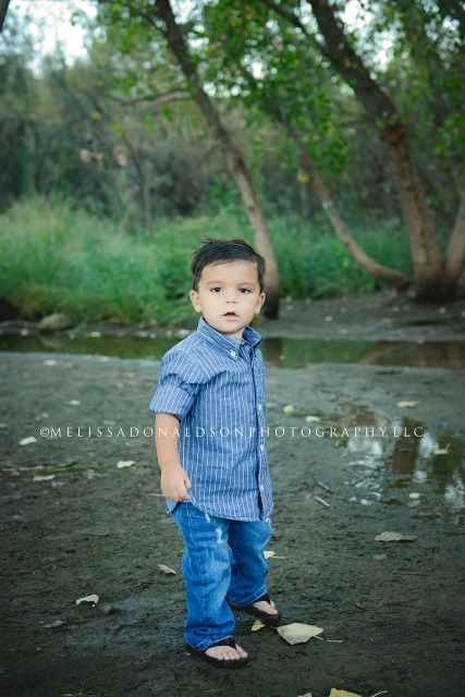 youngest son by pond in forest