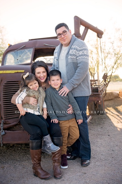 posed family on old chevy truck